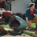 a man sitting on a wheelbarrow