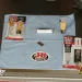 a blue bag with a few bottles of liquid in it